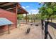 Spacious pig pen with sand and wooden fence, offering a comfortable environment for the animals at 3431 Saturn Rd, Brooksville, FL 34604