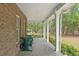 Relaxing covered porch area featuring a swing, perfect for enjoying the outdoors at 3431 Saturn Rd, Brooksville, FL 34604