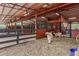 Spacious sheep pen with hay for feeding, providing a comfortable environment for the animals at 3431 Saturn Rd, Brooksville, FL 34604