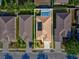Aerial view of the home showcasing the private pool, backyard, and surrounding neighborhood at 4321 High Ridge Ave, Spring Hill, FL 34609