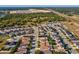 Aerial view of a residential area, showcasing community living and nearby recreation fields at 4321 High Ridge Ave, Spring Hill, FL 34609