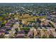 Expansive aerial view of a suburban neighborhood showcasing well-maintained homes and green spaces at 4321 High Ridge Ave, Spring Hill, FL 34609
