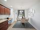 Cozy dining area features warm lighting and views of the backyard at 4321 High Ridge Ave, Spring Hill, FL 34609