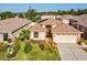 Lovely single-story home with a well-manicured lawn and mature landscaping at 4321 High Ridge Ave, Spring Hill, FL 34609