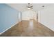 Spacious living room with tile flooring and blue accent wall at 4321 High Ridge Ave, Spring Hill, FL 34609