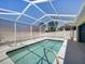 Inviting screened-in pool, perfect for relaxing and swimming while enjoying the outdoors in a private setting at 4321 High Ridge Ave, Spring Hill, FL 34609