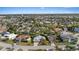 Wide angle view of a quiet residential neighborhood with a mix of single-Gathering homes and mature trees at 4504 Dewey Dr, New Port Richey, FL 34652