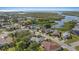 Neighborhood aerial view showcasing waterfront homes, lush greenery, and tranquil waterways at 4504 Dewey Dr, New Port Richey, FL 34652