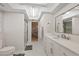Bathroom featuring a sleek glass shower, toilet, vanity, and modern design at 4504 Dewey Dr, New Port Richey, FL 34652