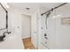 Bright bathroom features modern shower with sleek glass door at 4504 Dewey Dr, New Port Richey, FL 34652