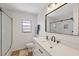 Modern bathroom features marble countertops and black fixtures at 4504 Dewey Dr, New Port Richey, FL 34652