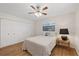 Neat bedroom features a ceiling fan, bright light and closet storage at 4504 Dewey Dr, New Port Richey, FL 34652
