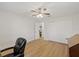 Neutral bedroom features a ceiling fan and bright, natural light throughout at 4504 Dewey Dr, New Port Richey, FL 34652