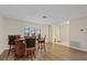 Open concept dining area with wood floors and neutral colors at 4504 Dewey Dr, New Port Richey, FL 34652