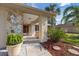 Charming entryway featuring stone accents, lush landscaping, and a welcoming front door at 4504 Dewey Dr, New Port Richey, FL 34652