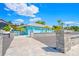 Charming exterior of building on beach featuring well-kept grounds and convenient parking at 4504 Dewey Dr, New Port Richey, FL 34652