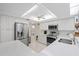 Bright, renovated kitchen features stainless appliances and white cabinetry at 4504 Dewey Dr, New Port Richey, FL 34652