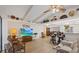 Living room boasts high ceilings, wood floors, and decor shelves at 4504 Dewey Dr, New Port Richey, FL 34652