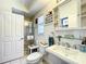 Bright bathroom with a glass enclosed shower and ample storage space at 4514 Fishman Ave, Weeki Wachee, FL 34607