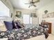 Comfortable bedroom features a floral comforter and lots of natural light at 4514 Fishman Ave, Weeki Wachee, FL 34607