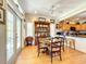 Cozy dining area features a wooden table, china cabinet, and access to a patio at 4514 Fishman Ave, Weeki Wachee, FL 34607