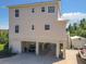Beautiful stilt home has ample parking, an enclosed garage, and covered outdoor space for entertaining and recreation at 4514 Fishman Ave, Weeki Wachee, FL 34607