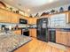 Modern kitchen with stainless steel appliances and ample counter space at 4514 Fishman Ave, Weeki Wachee, FL 34607