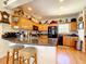 Well-lit kitchen featuring a breakfast bar, granite countertops, and modern appliances at 4514 Fishman Ave, Weeki Wachee, FL 34607