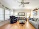 Spacious living room with hardwood floors, ample seating, and elegant decor for comfortable living at 4514 Fishman Ave, Weeki Wachee, FL 34607