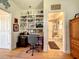 The home office includes a built-in bookcase and is adjacent to a full bathroom at 4514 Fishman Ave, Weeki Wachee, FL 34607