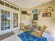 Cozy screened patio features comfortable seating and a relaxing outdoor space at 4514 Fishman Ave, Weeki Wachee, FL 34607