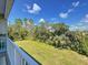Breathtaking view of the lush green landscaping from the upper level of this stunning home at 4514 Fishman Ave, Weeki Wachee, FL 34607