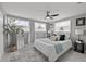 Bedroom with many windows and decorative mirror and houseplant at 4607 Kennedy Dr, New Port Richey, FL 34652