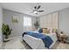 Bright bedroom with accent wall and ceiling fan at 4607 Kennedy Dr, New Port Richey, FL 34652