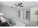 Light, bright bedroom with fan and closet at 4607 Kennedy Dr, New Port Richey, FL 34652