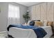 Comfortable bedroom with accent wall, and great natural light at 4607 Kennedy Dr, New Port Richey, FL 34652