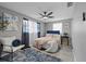 Stylish bedroom with blue accents, soft textures, and plenty of natural light creating a calming retreat at 4607 Kennedy Dr, New Port Richey, FL 34652