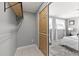 View of closet with open shelving and mirrored sliding doors, seamlessly connected to the Primary bedroom at 4607 Kennedy Dr, New Port Richey, FL 34652