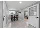 Dining room features gray walls, tile floors, and views to other rooms at 4607 Kennedy Dr, New Port Richey, FL 34652