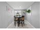 Dining room features gray walls, tile floors, and a window for natural light at 4607 Kennedy Dr, New Port Richey, FL 34652