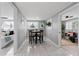 Dining room features gray walls, tile floors, and views to other rooms at 4607 Kennedy Dr, New Port Richey, FL 34652