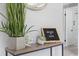 Inviting entryway with modern decor, stylish console table and tiled floors at 4607 Kennedy Dr, New Port Richey, FL 34652
