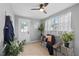 Bright sitting area with neutral decor, plants, and natural light, creating a serene and airy space at 4607 Kennedy Dr, New Port Richey, FL 34652