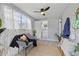 Bright and inviting sitting area with plants, neutral decor, and view into the adjacent updated bathroom at 4607 Kennedy Dr, New Port Richey, FL 34652