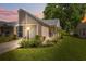 Charming home with manicured lawn, cozy front porch, and attached garage at 4856 Alamo Ct # 4856, New Port Richey, FL 34655