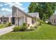 Charming home with manicured lawn, cozy front porch, and attached garage at 4856 Alamo Ct # 4856, New Port Richey, FL 34655