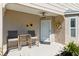 Inviting front porch area, decorated with sunflowers and a ceiling fan at 4856 Alamo Ct # 4856, New Port Richey, FL 34655