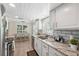 Bright kitchen with white cabinets, stainless appliances, and granite countertops at 4856 Alamo Ct # 4856, New Port Richey, FL 34655