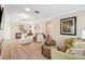 Bright living room with modern decor, comfortable seating, and large tile floors at 4856 Alamo Ct # 4856, New Port Richey, FL 34655