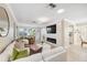 Stylish living room with fireplace, mounted TV, and modern furnishings at 4856 Alamo Ct # 4856, New Port Richey, FL 34655